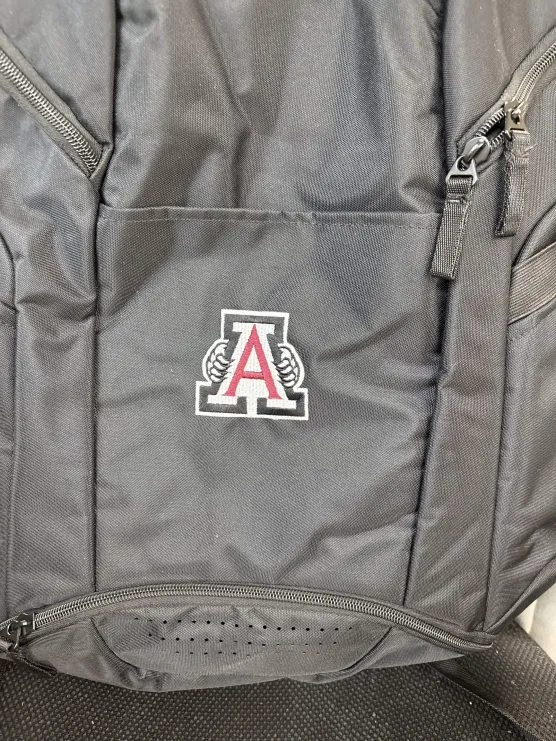 Block A logo embroidered on a grey backpack
