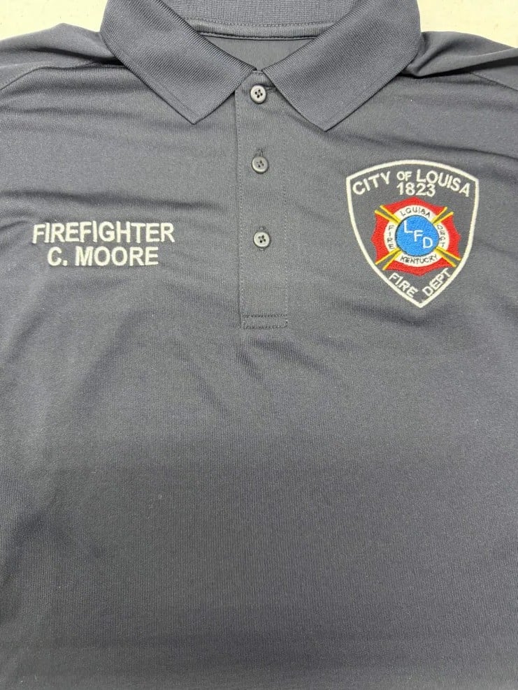 City of Louisa Fire Department polo with an embroidered department patch and firefighter name