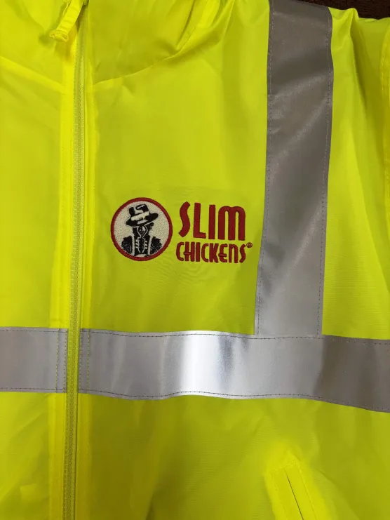 Slim Chickens logo embroidered on a hi-vis safety jacket