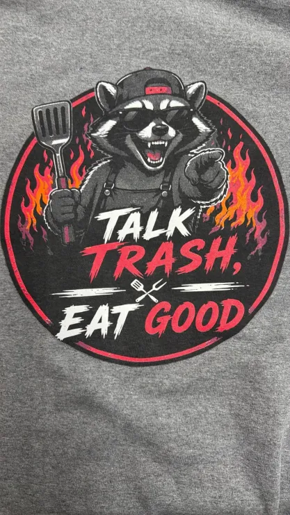 Talk Trash, Eat Good raccoon design printed on a grey shirt