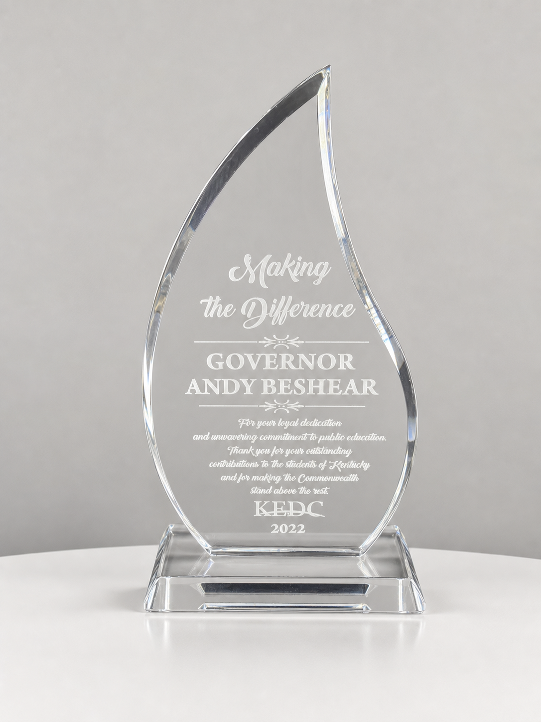 Engraved acrylic flame award, Making the Difference, presented to Governor Andy Beshear